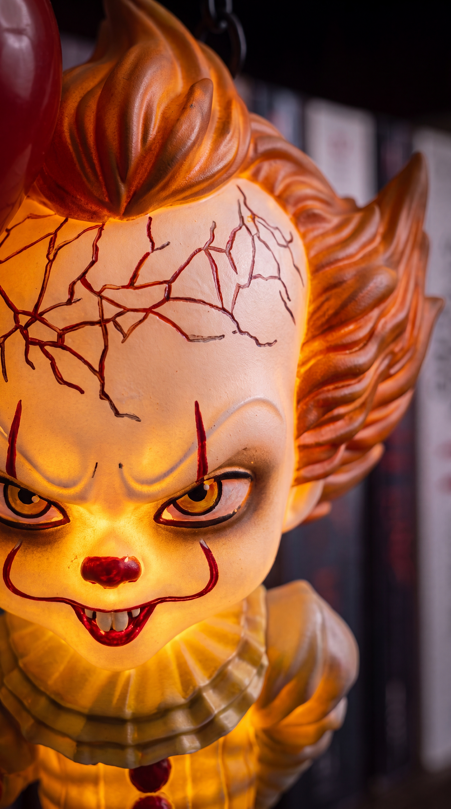 Close-up of hand-painted cracked face detail and warm amber glow